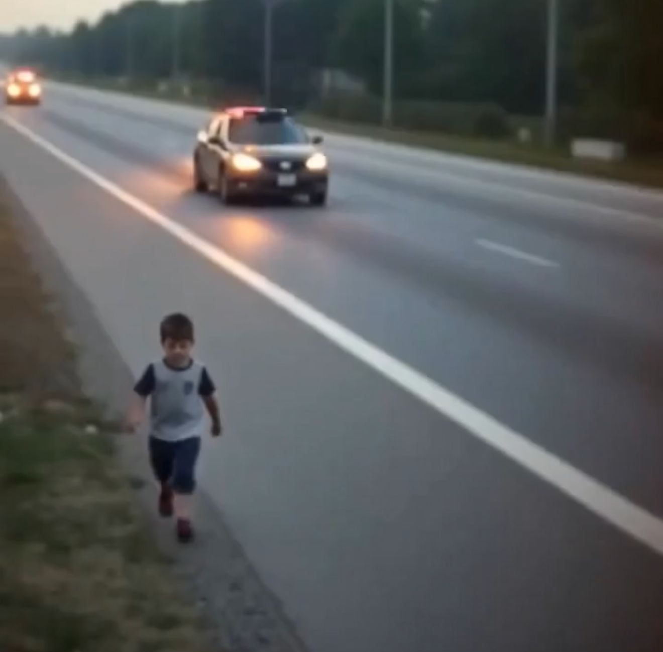 A police officer noticed a little boy—no older than three—wandering by himself along the edge